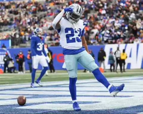 Jaydon Blue celebrates in the end zone for the Dallas Cowboys after scoring a touchdown