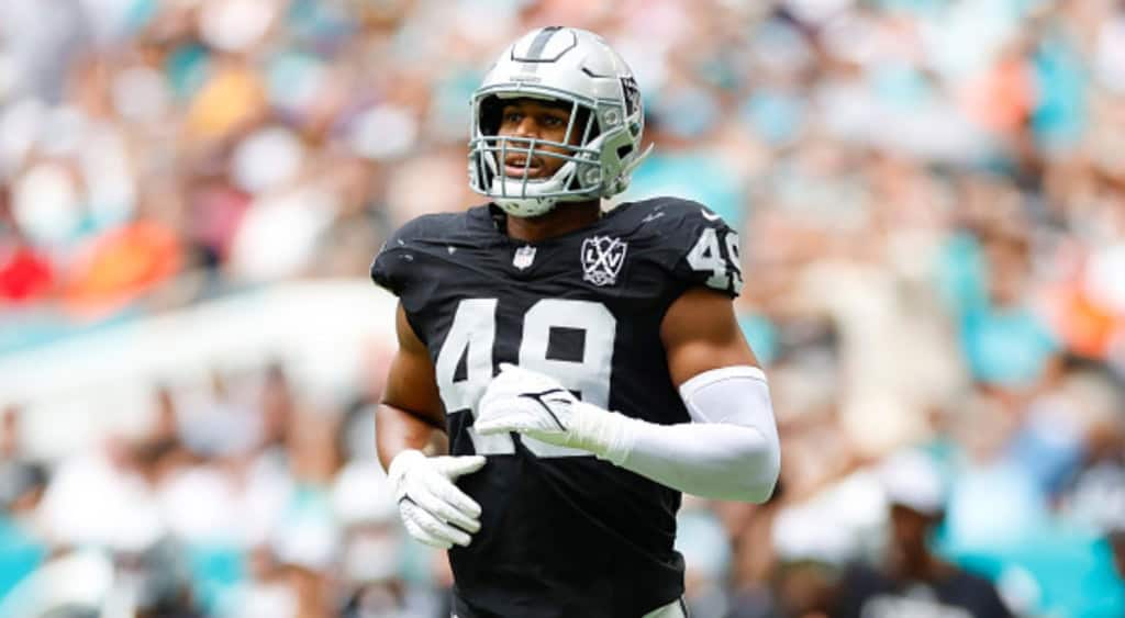 Charles Snowden jogging on the field in a Las Vegas Raiders uniform.