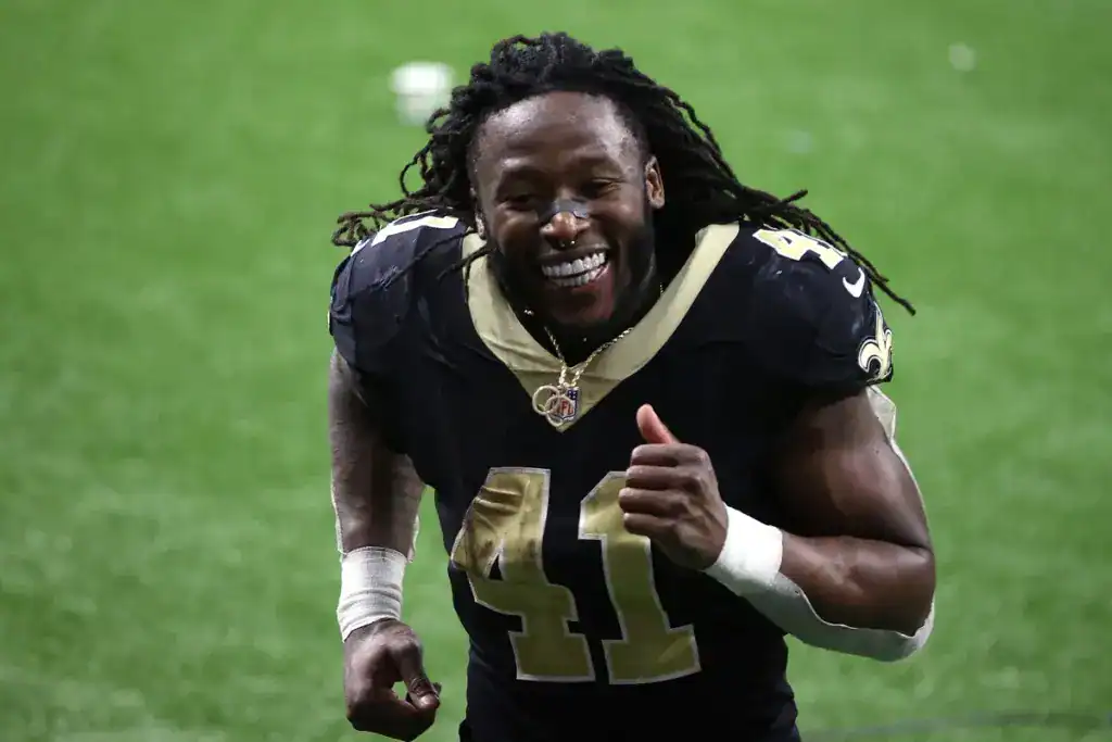 Cowboys Trading For Alvin Kamara Works if the Money's Right Alvin Kamara smiles during a Saints game, representing the veteran running back Dallas could consider in a cost-controlled trade.