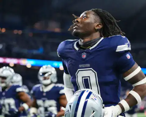 DeMarvion Overshown looks upward while wearing the Dallas Cowboys navy home uniform.