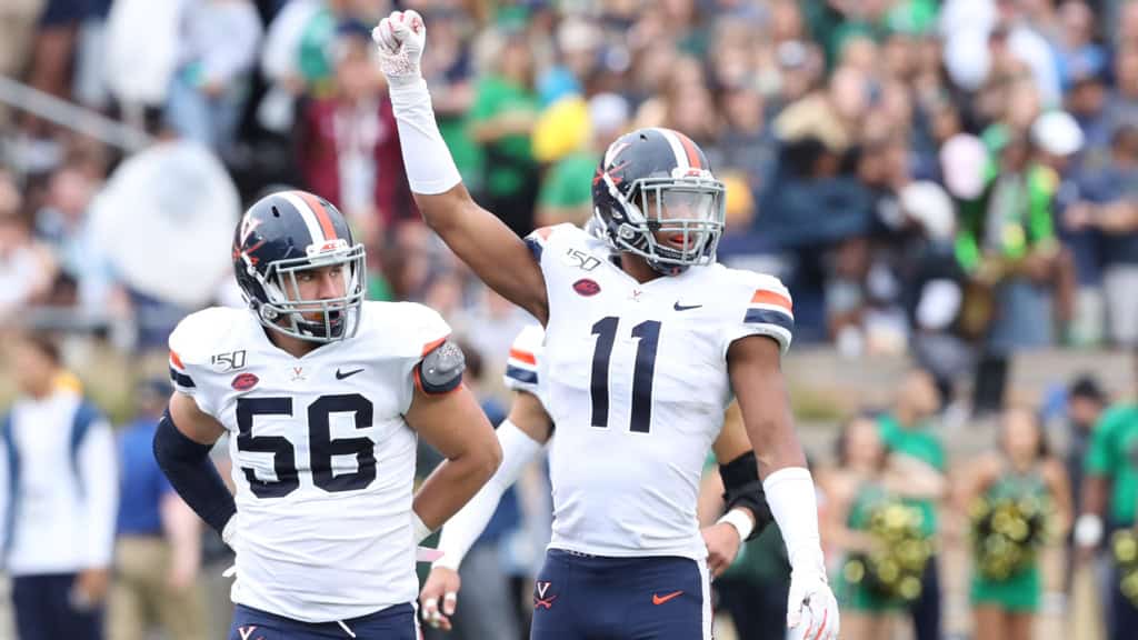 Charles Snowden celebrating during his college football career at Virginia.