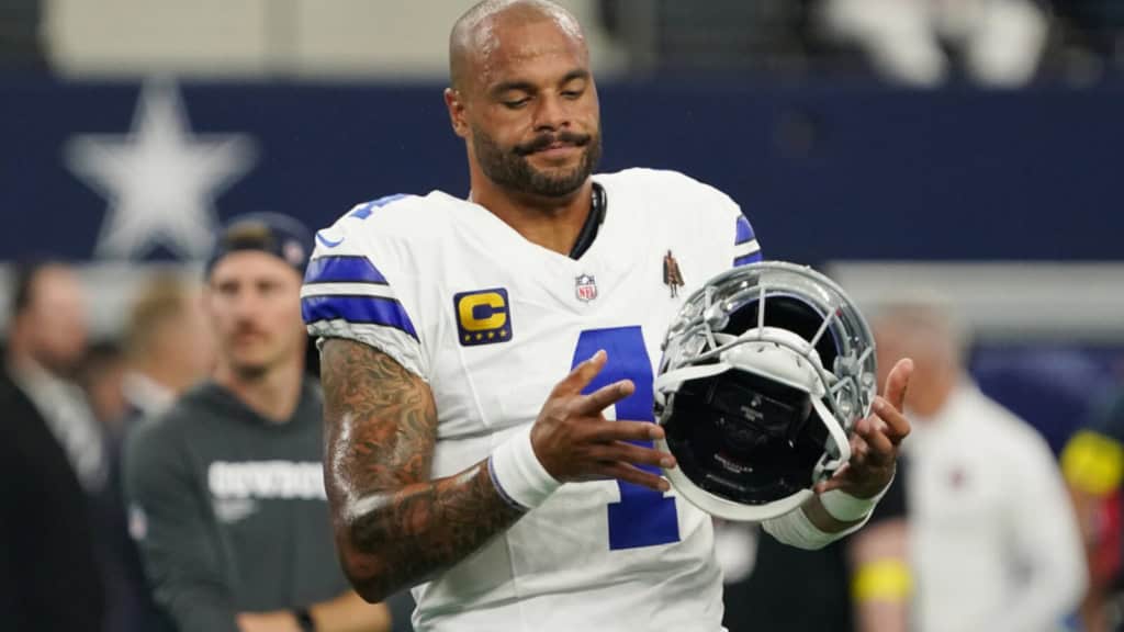 Cowboys Fans Misunderstand What a Franchise Quarterback Is Dak Prescott holds his helmet after a Cowboys game, with a look of frustration.