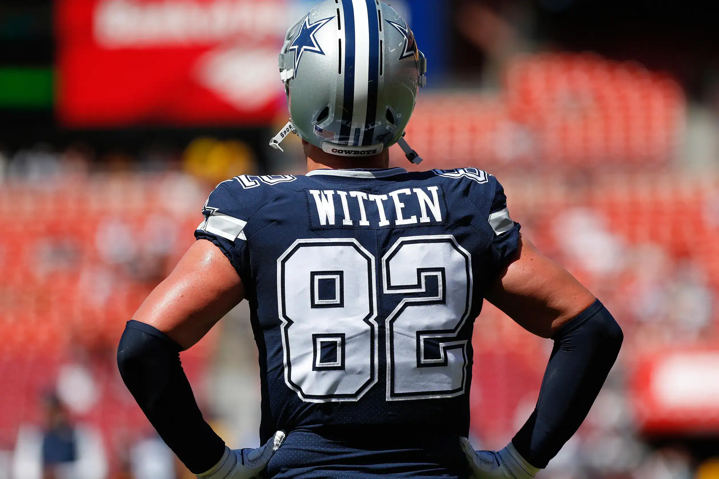 Jason Witten walking off the field with footballs in hand, showing why Canton must get his Dallas Cowboys legacy right.