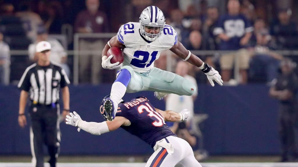 The Cowboys Aren't Cheap—Their Spending Problem Is Worse Ezekiel Elliott hurdles a Bears defender, representing one of the Cowboys’ biggest second-contract investments under Jerry Jones.