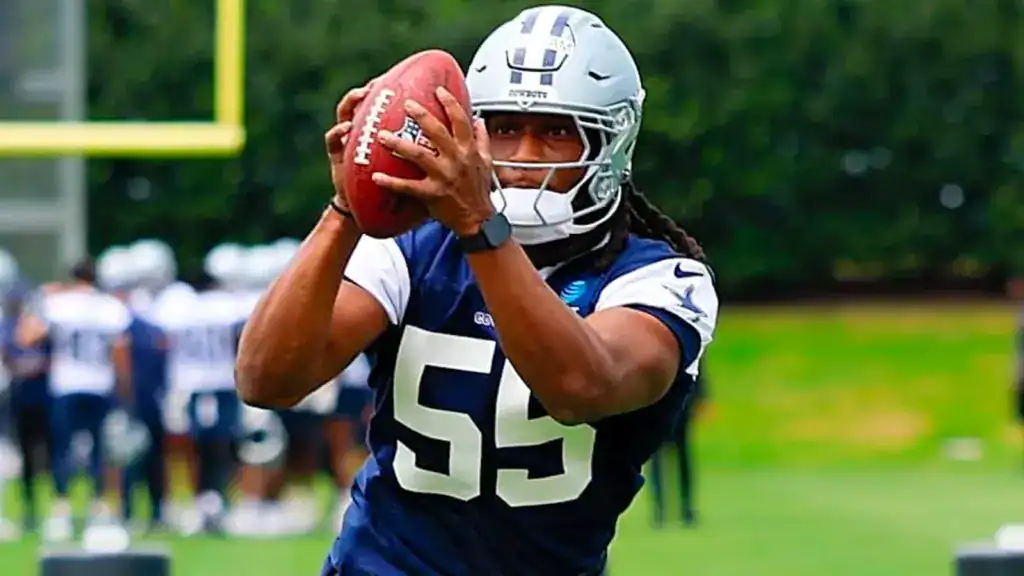 Jaishawn Barham: A Dark Horse 26' Defensive Rookie of the Year Candidate Dallas Cowboys linebacker Jaishawn Barham catches a football during rookie minicamp practice.