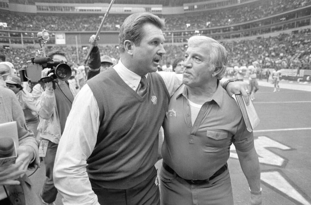 Christian Parker's Hire Follows a Cowboys Super Bowl Pattern Former Dallas Cowboys defensive coordinator Ernie Stautner walking off the filed talking to Chicago Bears head coach Mike Ditka.