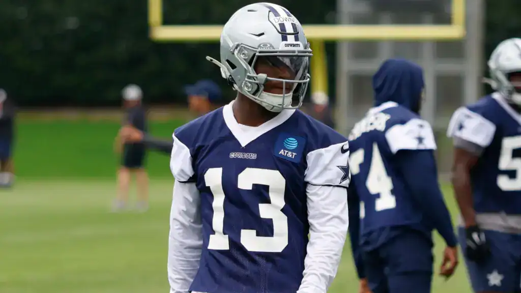 Caleb Downs wearing No. 13 during Dallas Cowboys training camp practice.