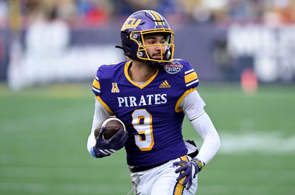 Dallas Cowboys rookie wide reciever Anthony Smith in his East Carolina University uniform running with the football after a reception.