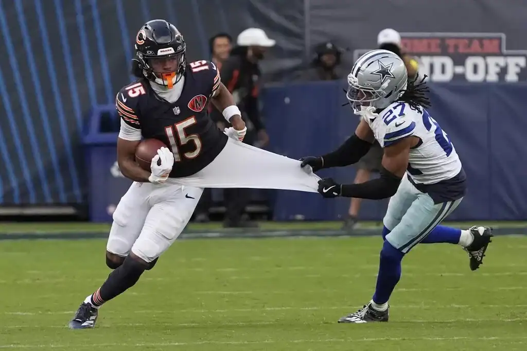 Dallas Cowboys defensive back Reddy Steward grabs a Chicago Bears receiver’s jersey during a play that reflects the defense’s deeper problems.