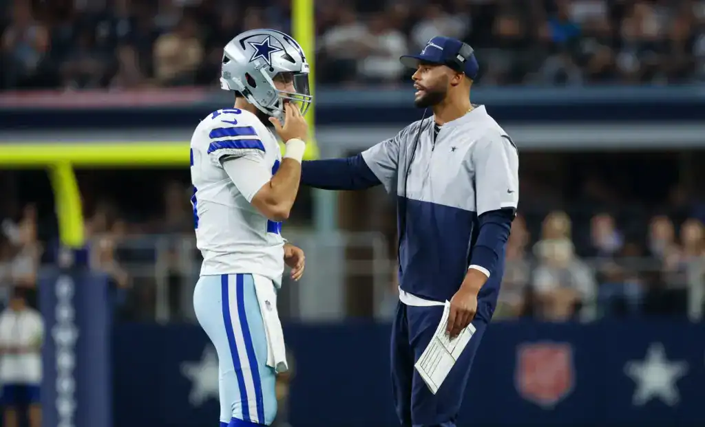 Will Grier's Cowboys Story May Not Be Over Dak Prescott gives Will Grier instructions during a Dallas Cowboys game at AT&T Stadium.