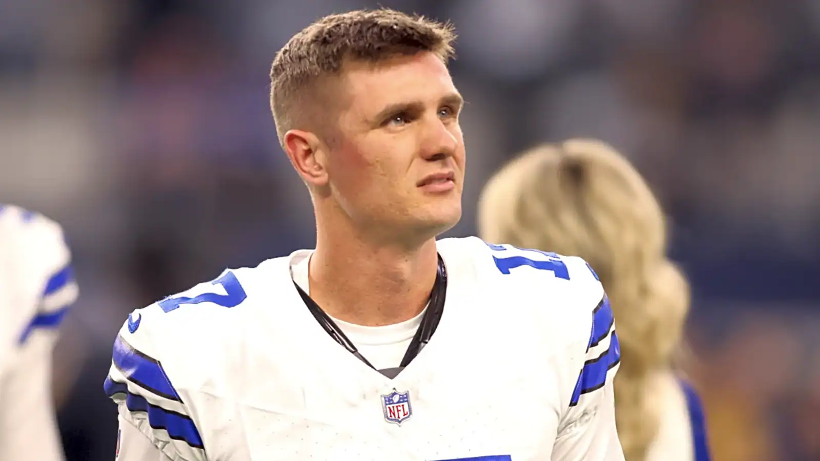 Brandon Aubrey watches from the sideline as the Dallas Cowboys kicker remains a top fantasy football option at his position.