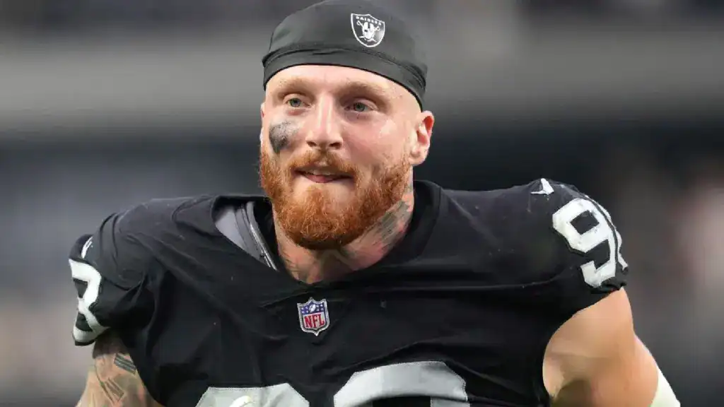Las Vegas Raiders defensive end Maxx Crosby looks toward the sideline while wearing his black Raiders uniform.