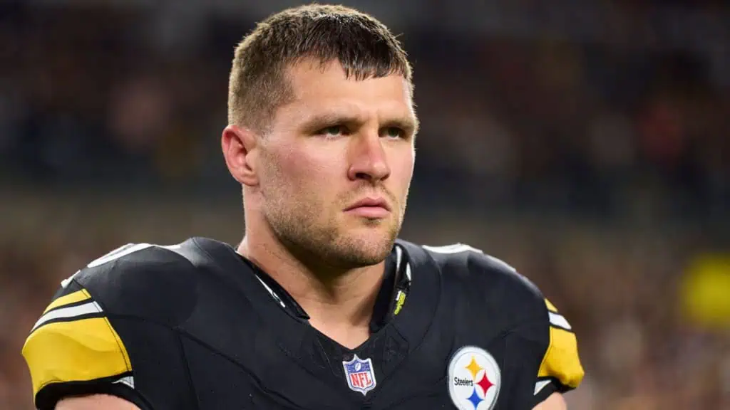 Pittsburgh Steelers edge rusher T.J. Watt looks on from the field in his black and gold uniform.