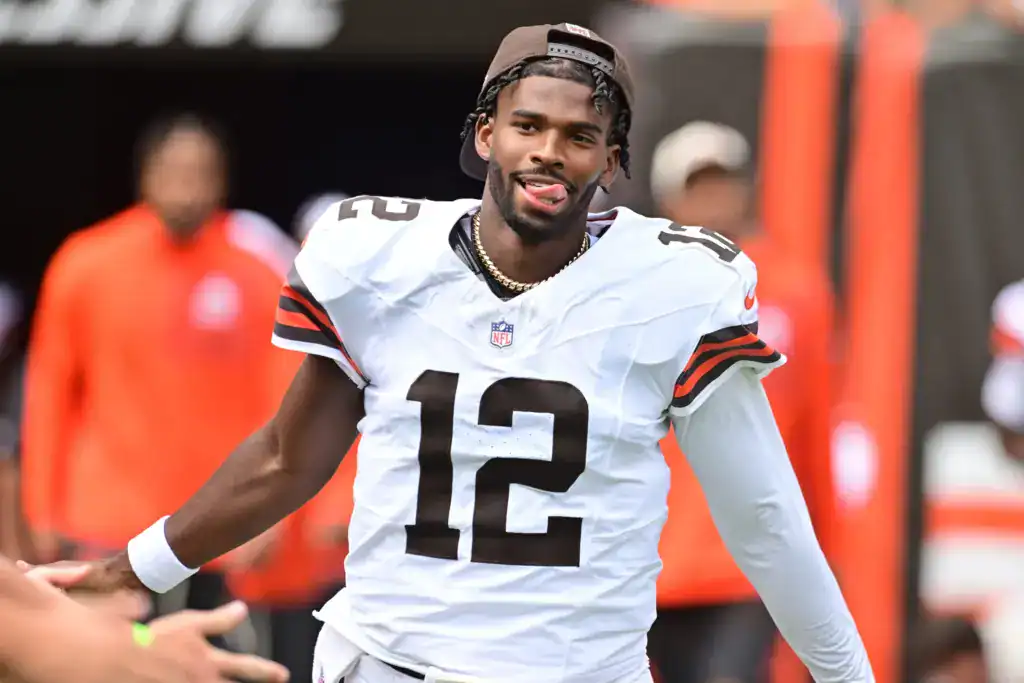 Will Cowboys Nostalgia Bring Shedeur Sanders to Dallas? Shedeur Sanders greets fans before a Cleveland Browns game while wearing his white No. 12 jersey.