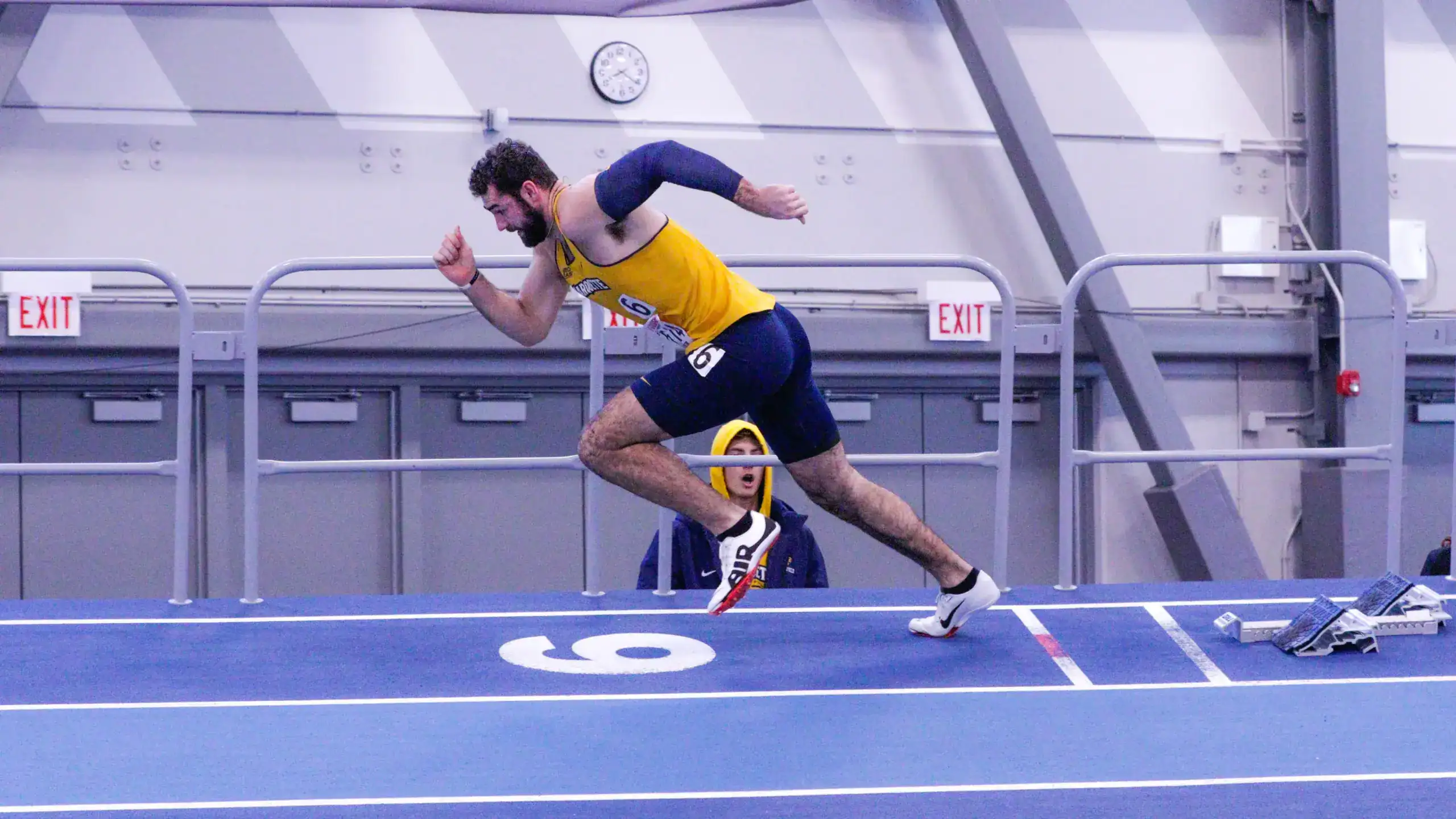 Mitch Van Vooren competes in an indoor track event before pursuing an NFL career.