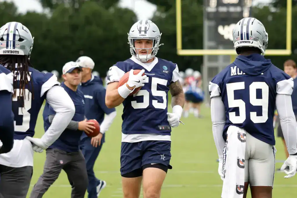 3 Cowboys Preseason Pet Cats to Watch Linebacker Justin Barron carries the football during a Dallas Cowboys training camp drill.