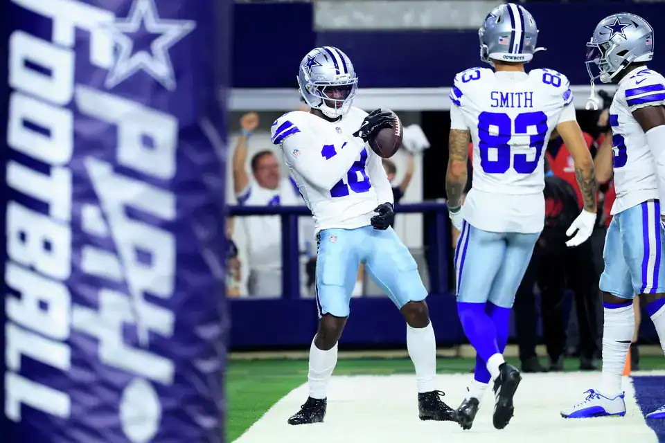 Jordan Hudson celebrates with the football near the end zone during Dallas Cowboys preseason action. Will Hudson make the Cowboys practice squad?