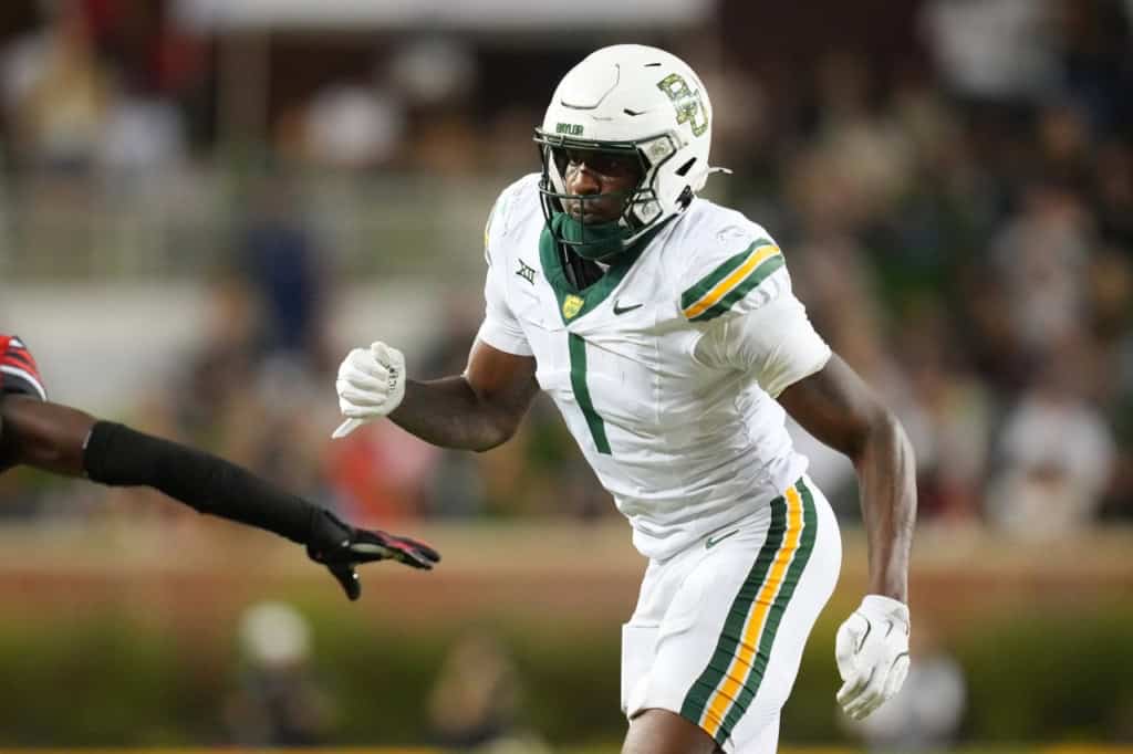 Cowboys Should Make Room for Michael Trigg in 26' Michael Trigg in Baylor’s white No. 1 uniform runs upfield during a college football game.