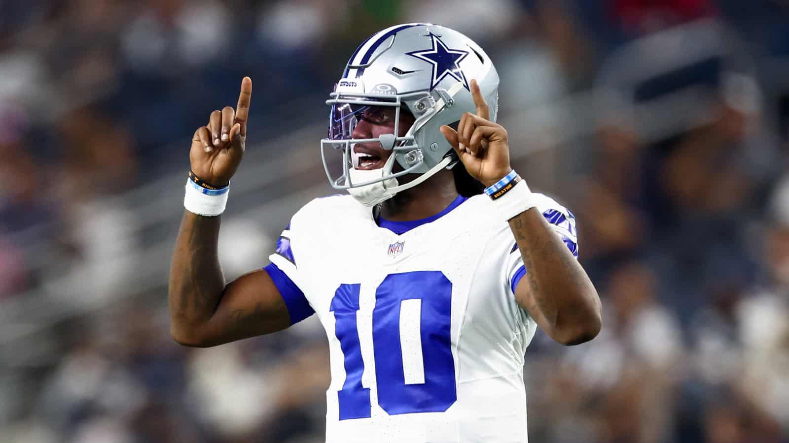 Dallas Cowboys quarterback Joe Milton III celebrates during a preseason game at AT&T Stadium.