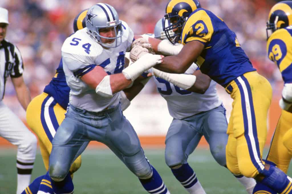 Dallas Cowboys defensive tackle Randy White battles Los Angeles Rams guard Kent Hill in a historic matchup featured in a look at Cowboys preseason history.