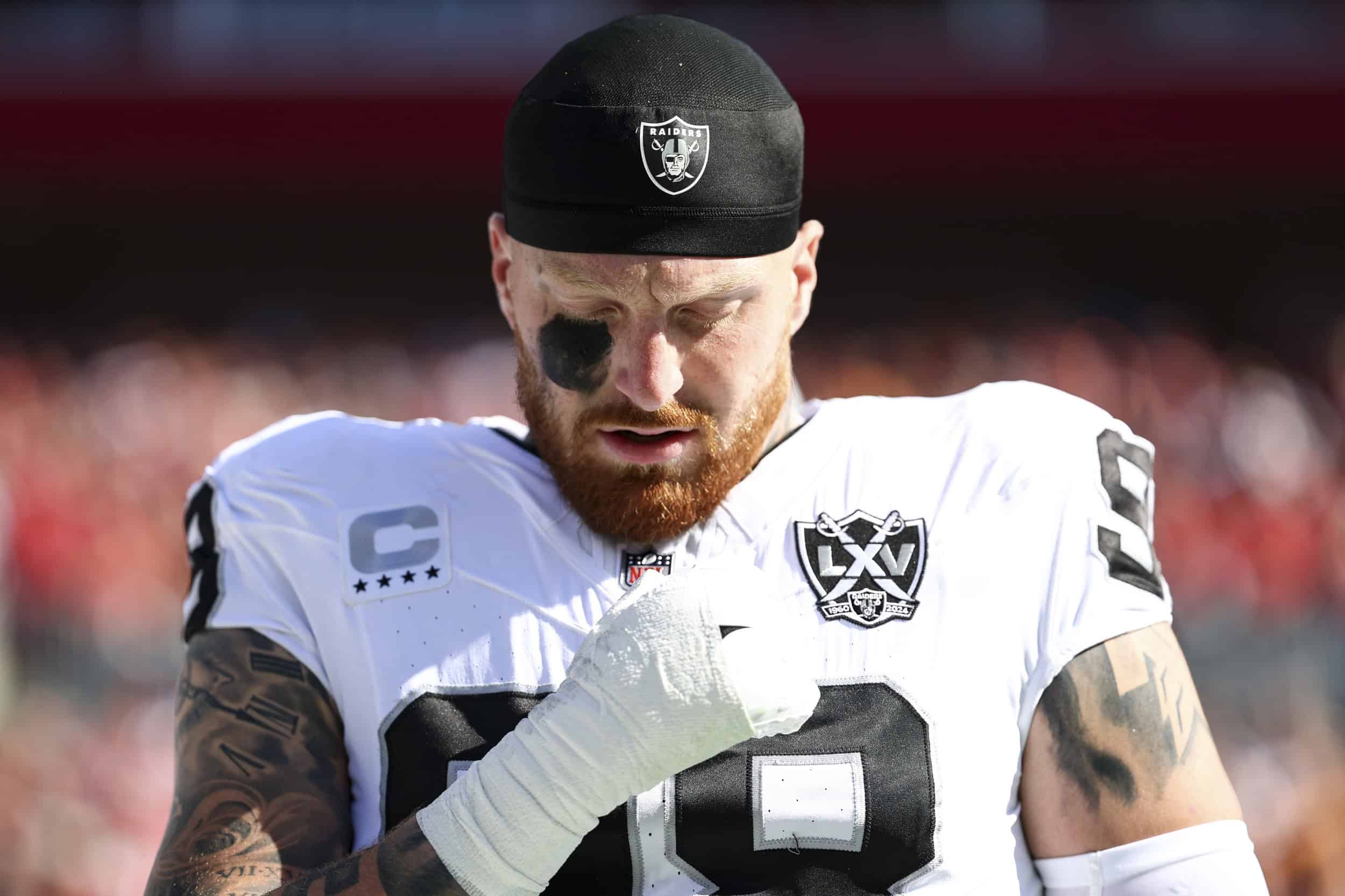 Las Vegas Raiders edge rusher Maxx Crosby looks down during a game as Dallas considers whether a receiver-based trade package could bring him to the Cowboys.