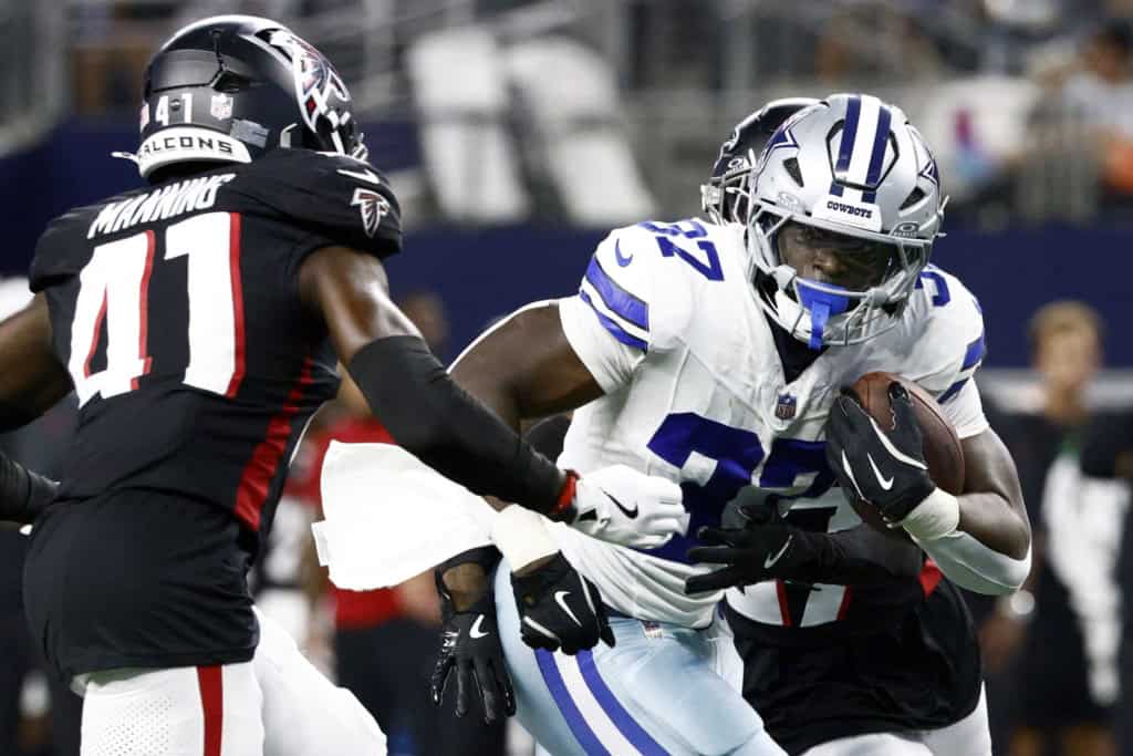 Cowboys Preseason Game 1: A Running Back Conundrum Dallas Cowboys running back Phil Mafah protects the football while fighting through contact from Atlanta Falcons defenders.