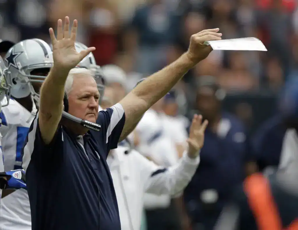 Dallas Cowboys head coach Wade Phillips signals from the sideline in a historical Cowboys image featured in a look at Dallas preseason history.