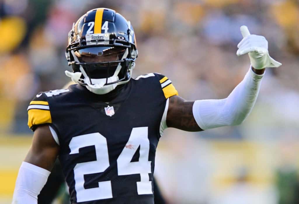 Steelers corner Joey Porter Jr. in a black and gold Pittsgburgh Steelers uniform gesturing with his left hand. 