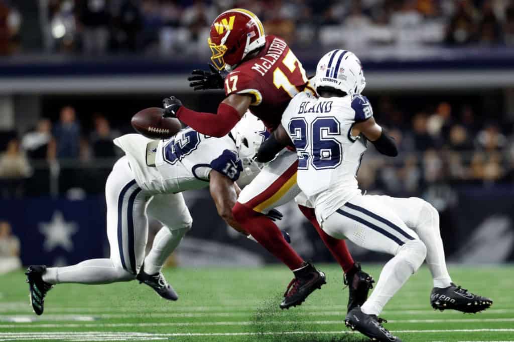 Dallas Cowboys cornerback DaRon Bland making a stop on Washington Commander receiver Terry McLauren.
