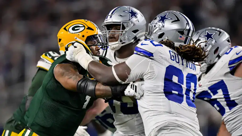 Dallas Cowboys left tackle Tyler Guyton blocking Green Bay Packers defensive end Micah Parsons. 