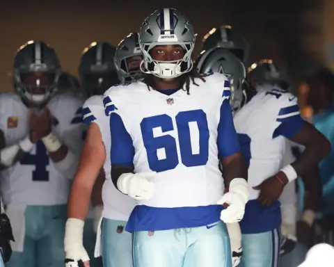 Dallas Cowboys left tackle Tyler Guyton runs out of the tunnel at a Cowboys home game.