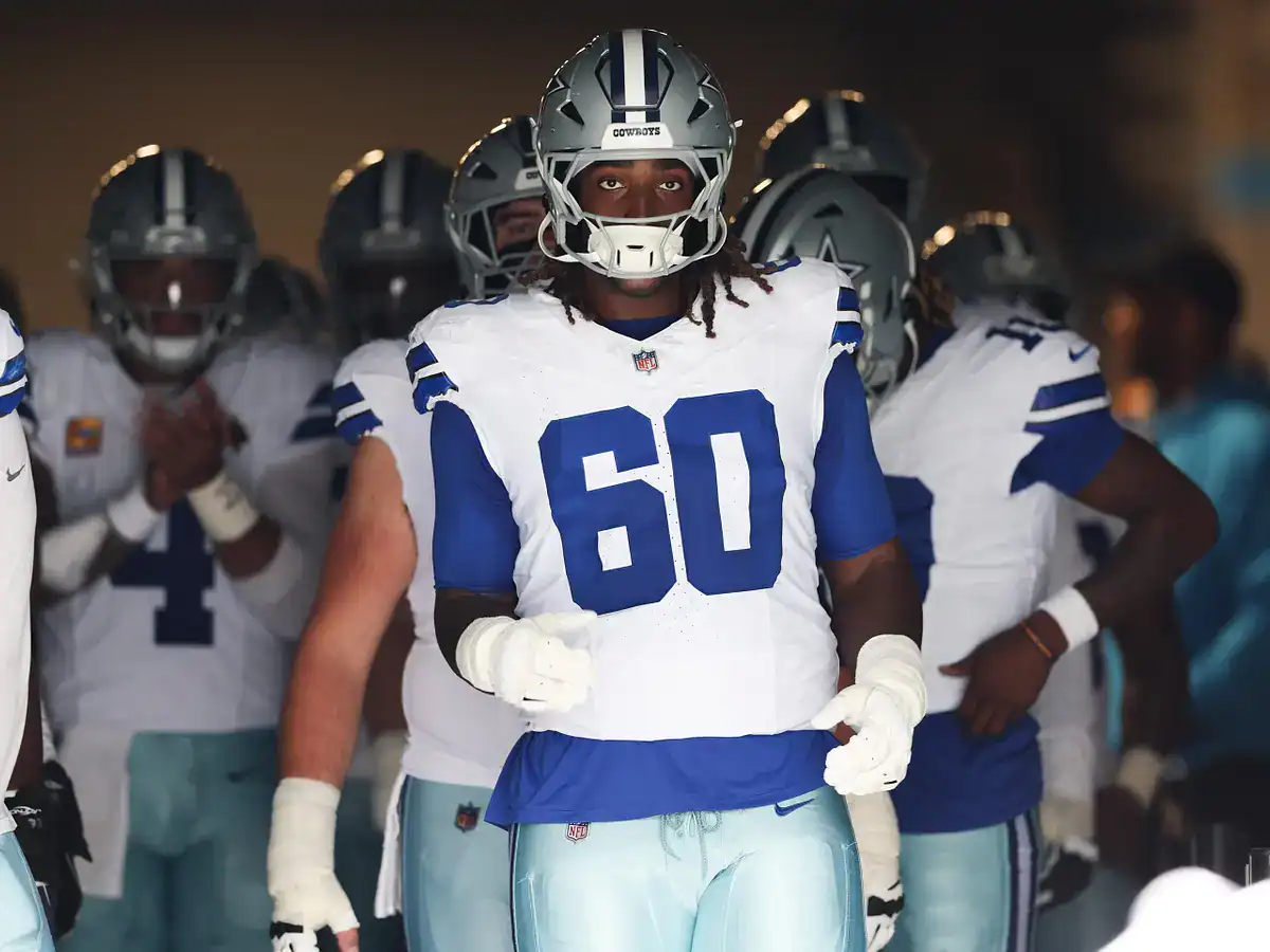 Dallas Cowboys left tackle Tyler Guyton runs out of the tunnel at a Cowboys home game.
