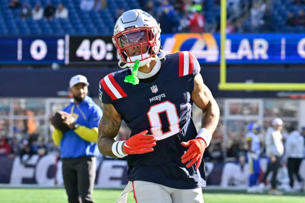 New England Patriots corner Christian Gonzalez jogging during warmups before a game against the LA Rams.
