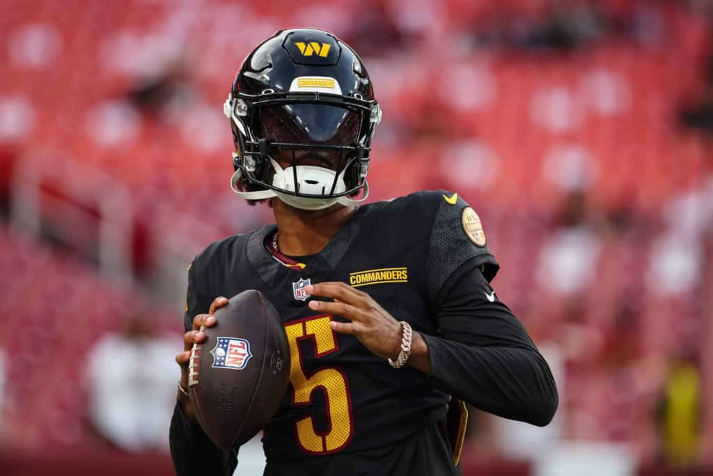 Washington Commanders quarterback Jayden Daniels getting ready to make a pass. 
