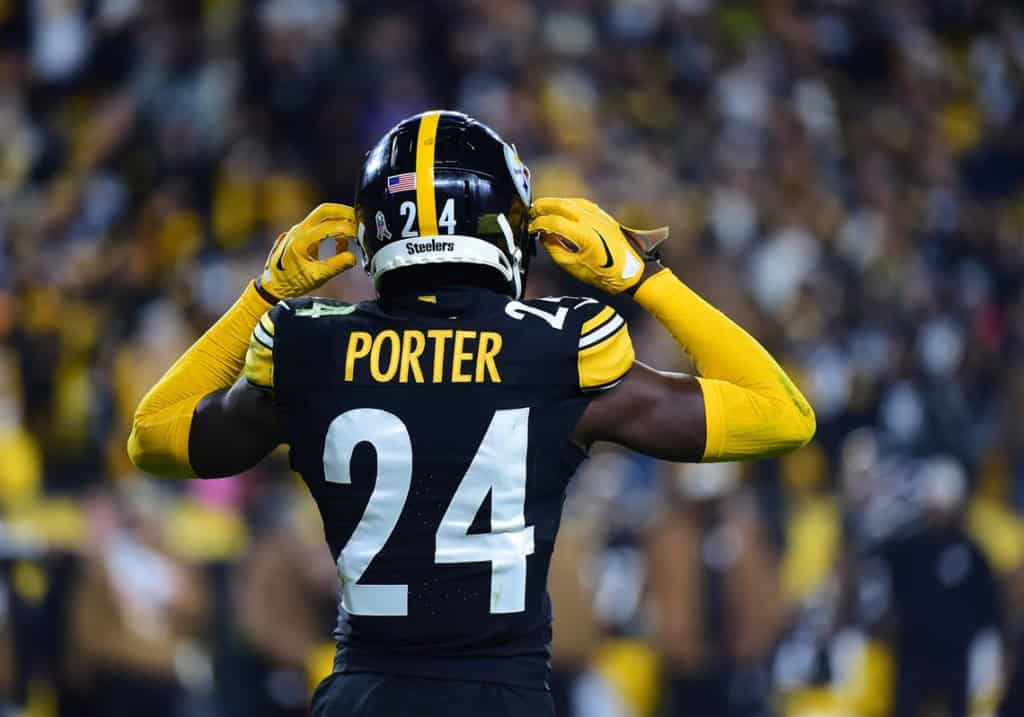 The 26' Cowboys and Joey Porter Jr: Does He Fit? Steelers cornerback Joey Porter Jr. adjusting his helmet on the field.