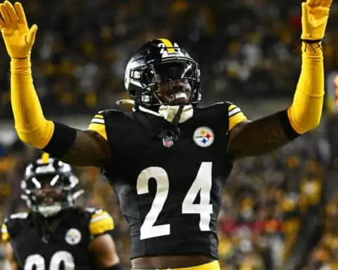 Steelers Joey Porter Jr. celebrating with the crowd after a big play.