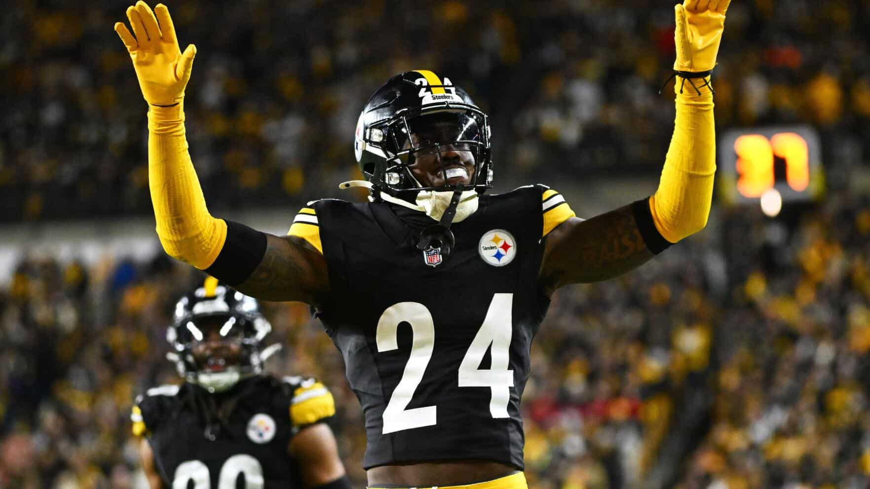Steelers Joey Porter Jr. celebrating with the crowd after a big play.
