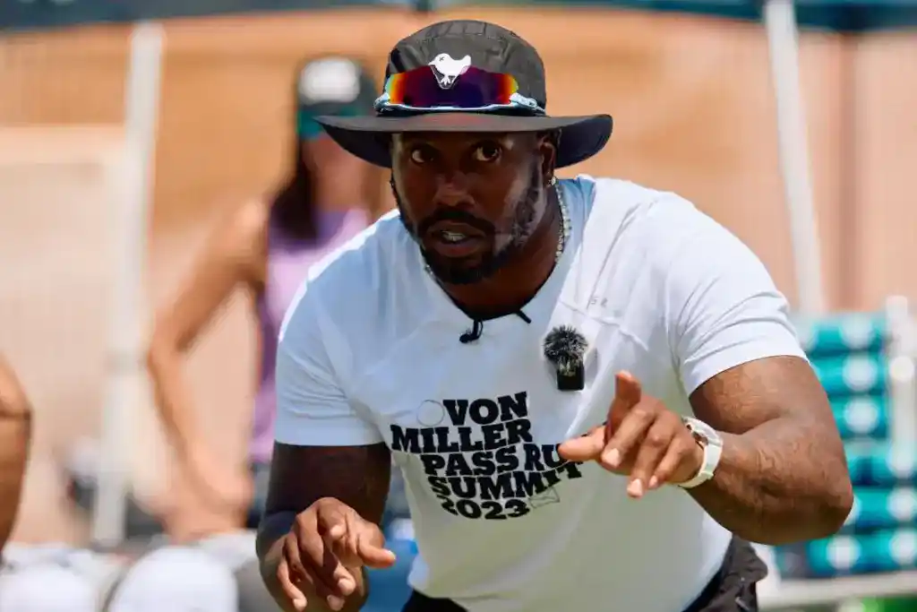 Dallas Cowboys linebacker Von Miller teaching young athletes at his Passing Summit.