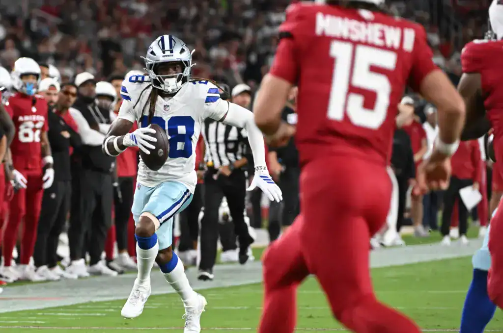 Dallas Cowboys wide receiver CeeDee Lamb running with the football against the Arizona Cardinals. 