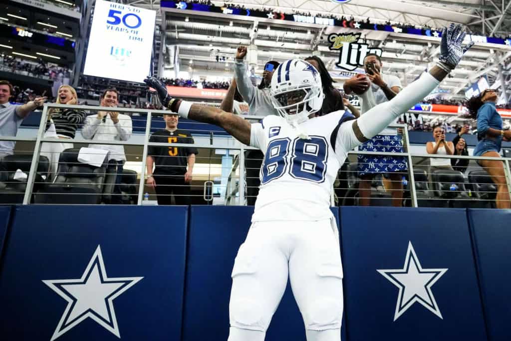 Dallas Cowboys CeeDee Lamb celebrates with fans after a touchdown reception.