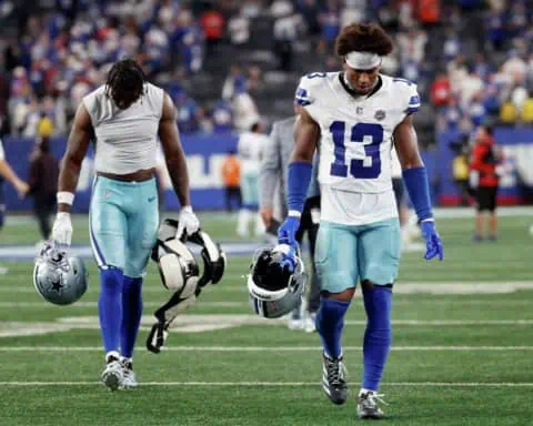 Dallas Cowboys safety Caleb Downs walks off the field with his head down as the defense fails again.