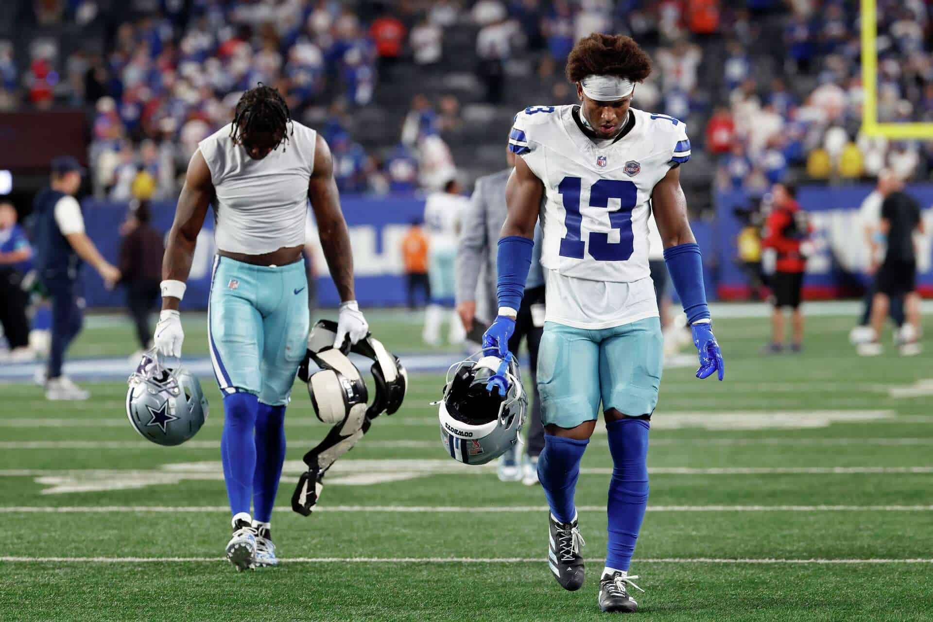 Dallas Cowboys safety Caleb Downs walks off the field with his head down as the defense fails again.