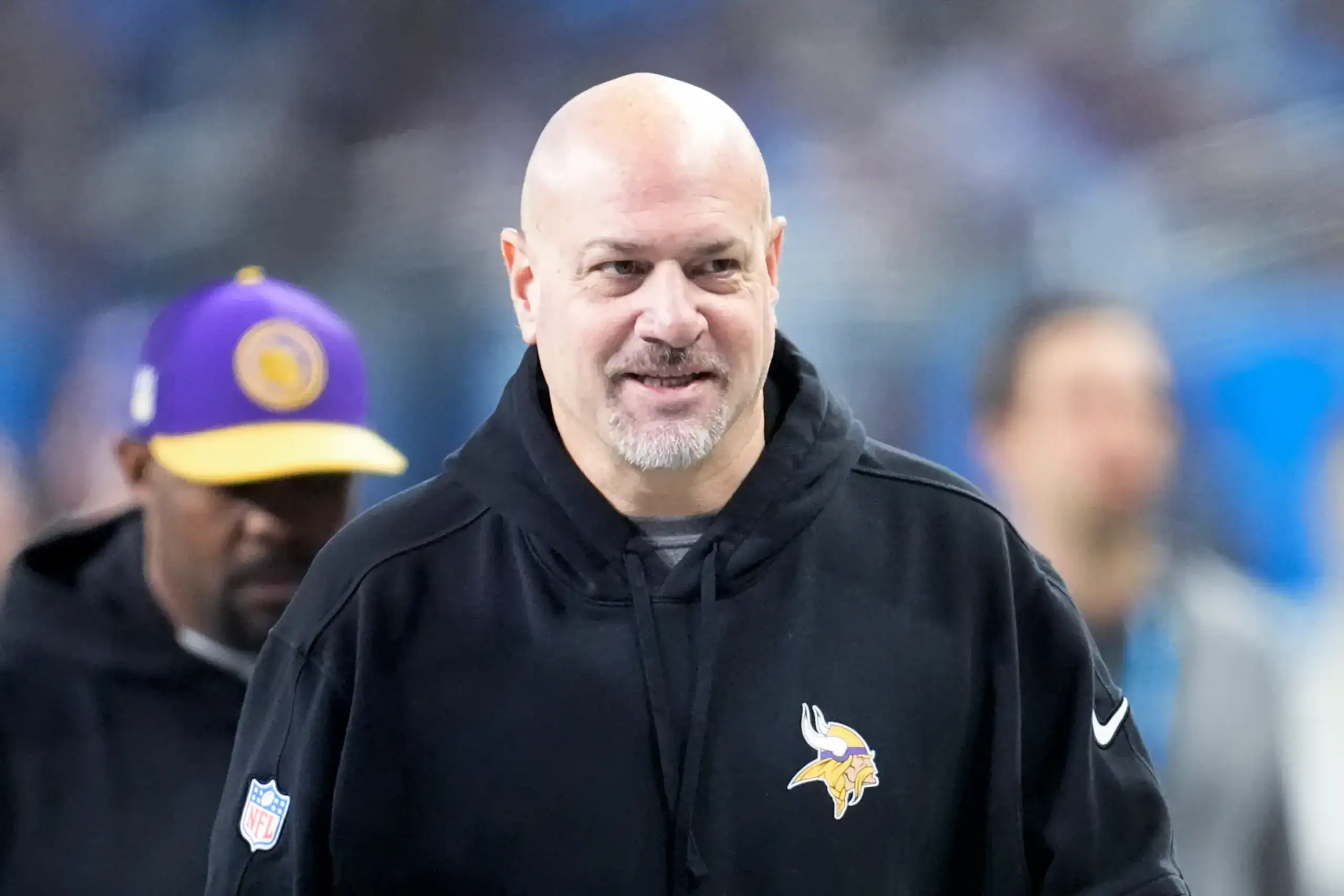 Vikings assistant Mike Pettine standing on the sidelines of a game.