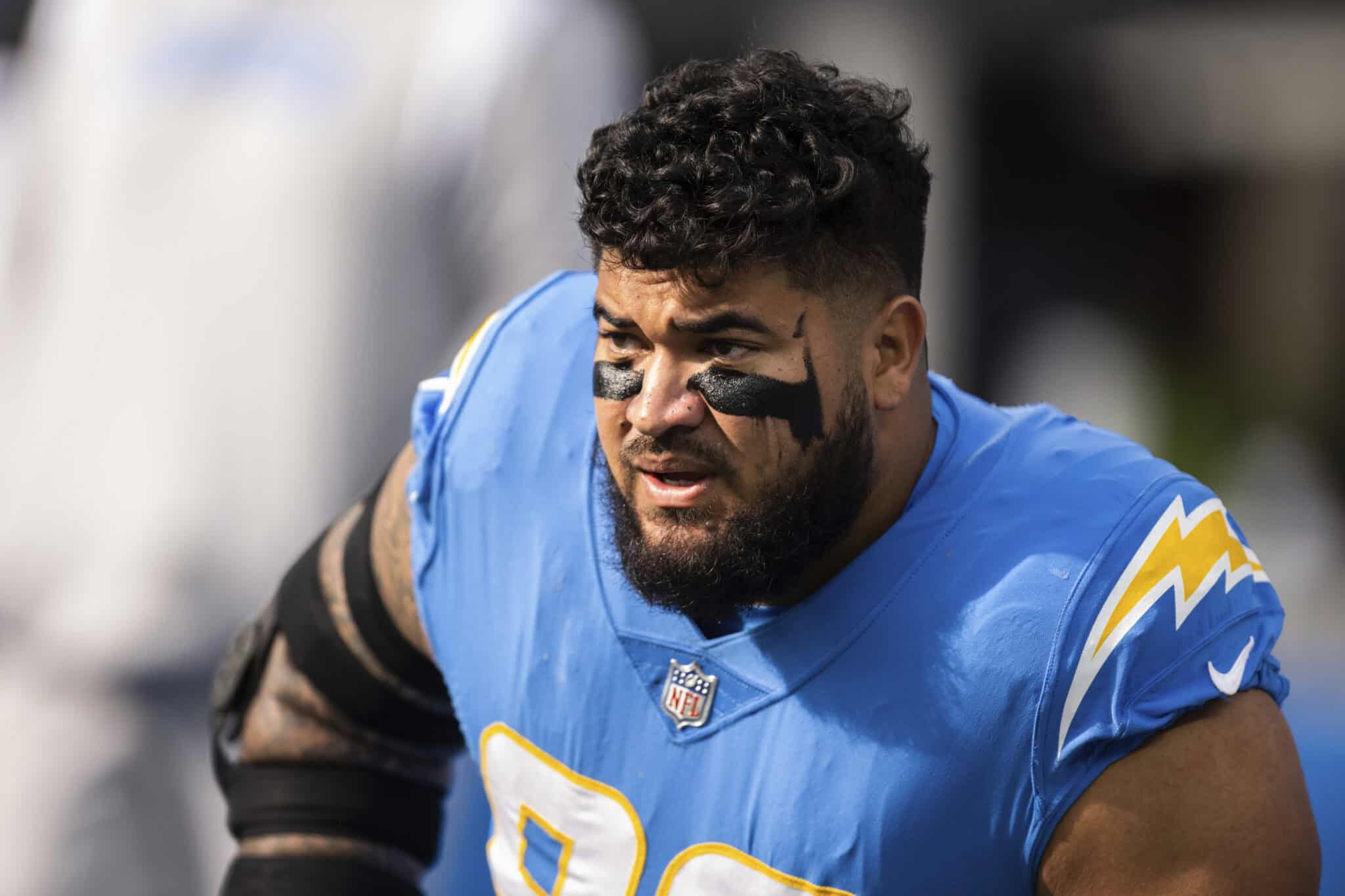 Los Angeles Chargers defensive tackle Breiden Fehoko stretches before an NFL football game.
