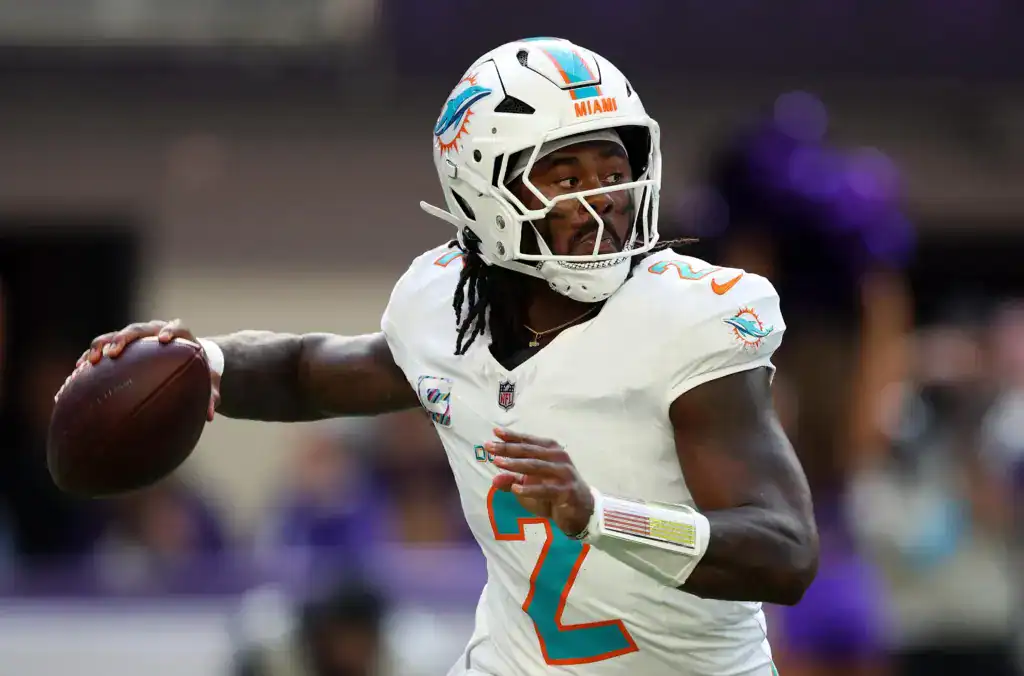 Miami Dolphins quarterback Malik Willis looks downfield to pass as part of a Dolphins offense that couldn't muster more yards than CeeDee Lamb.