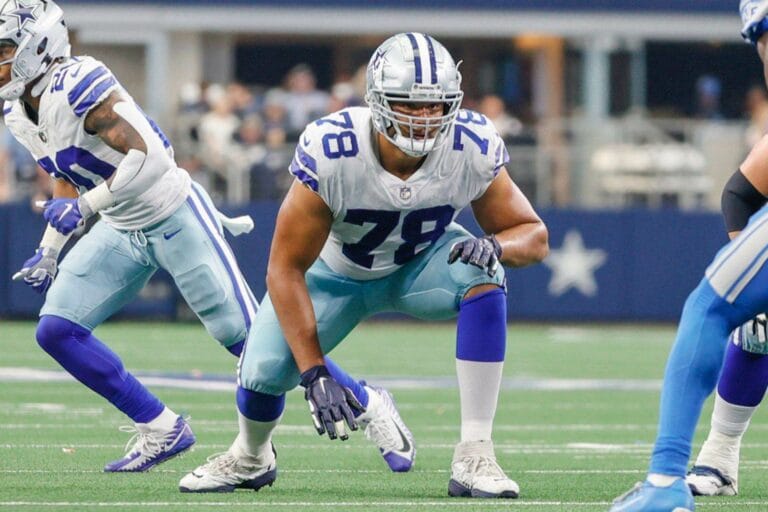 Cowboys' football player Terence Steele, in his number 78 jersey, crouches gracefully on the field, prepared to execute the second-round tender play.