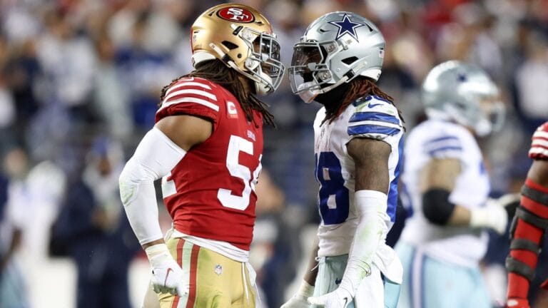 During Week 8, two American football players from opposing teams face off with the intensity of Cowboys vs. 49ers on the field.