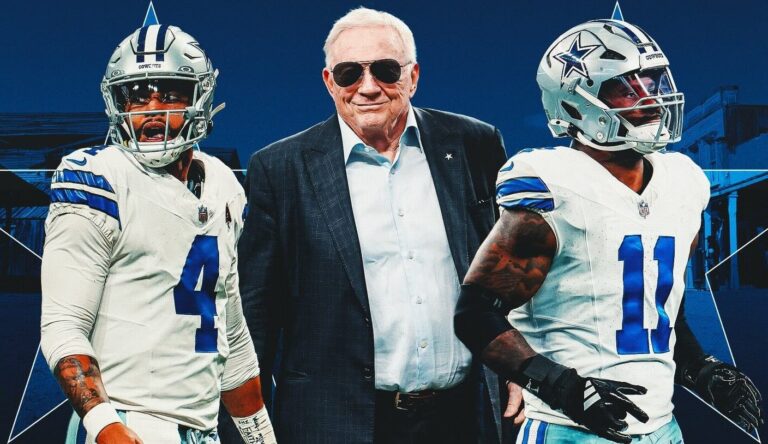 a man standing next to football players