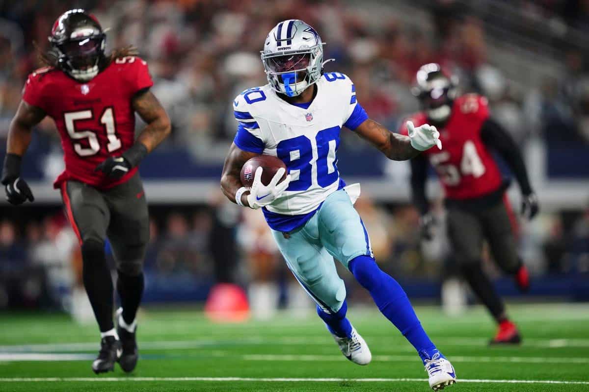 a football player running with a football
