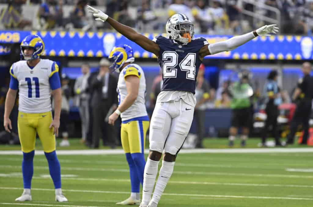 Dallas Cowboys player Israel Mukuamu wearing a number 24 navy blue jersey and silver pants. Cowboys Israel Mukuamu Deserves More Opportunities On Defense